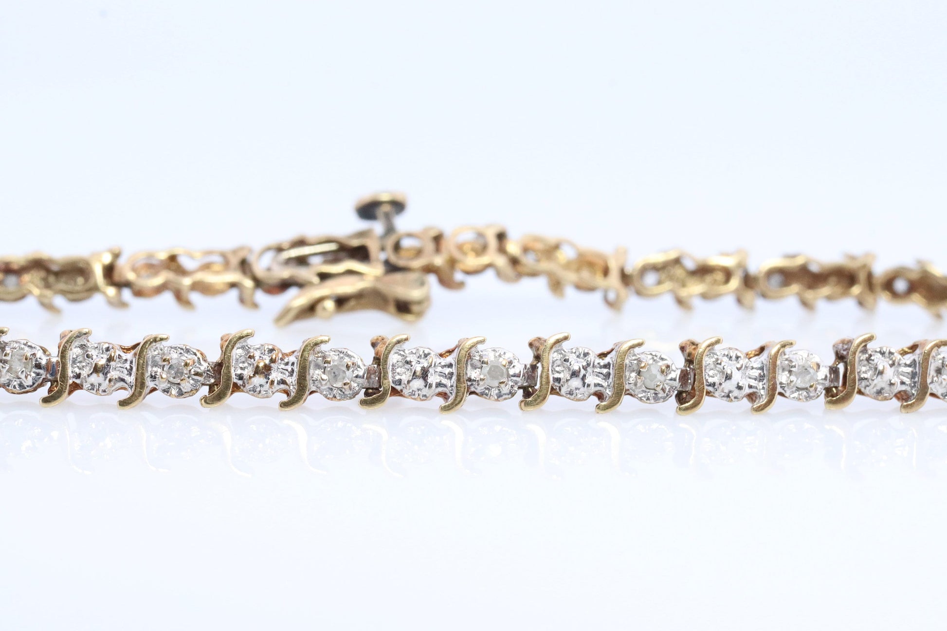 10k Diamond Tennis Bracelet. 10k S-LINK round diamond Tennis bracelet.
