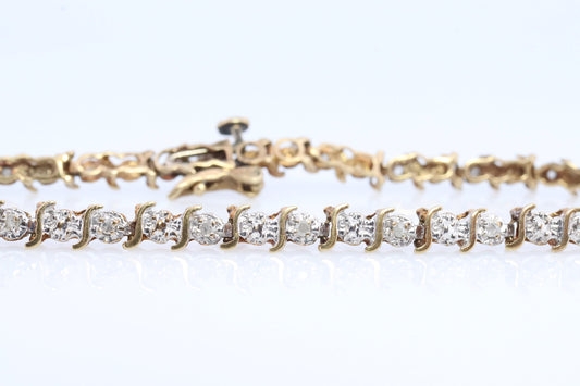 10k Diamond Tennis Bracelet. 10k S-LINK round diamond Tennis bracelet.
