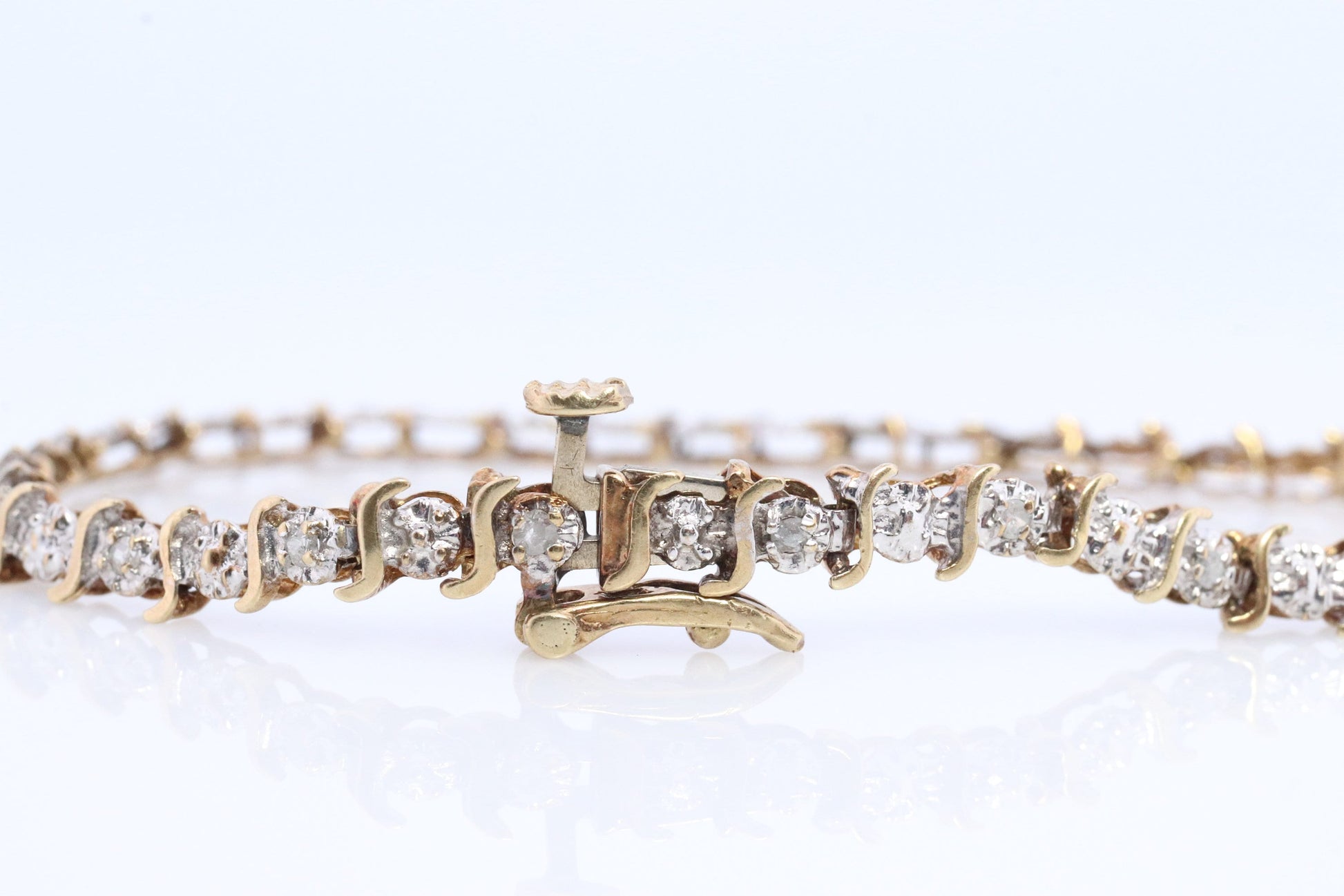 10k Diamond Tennis Bracelet. 10k S-LINK round diamond Tennis bracelet.