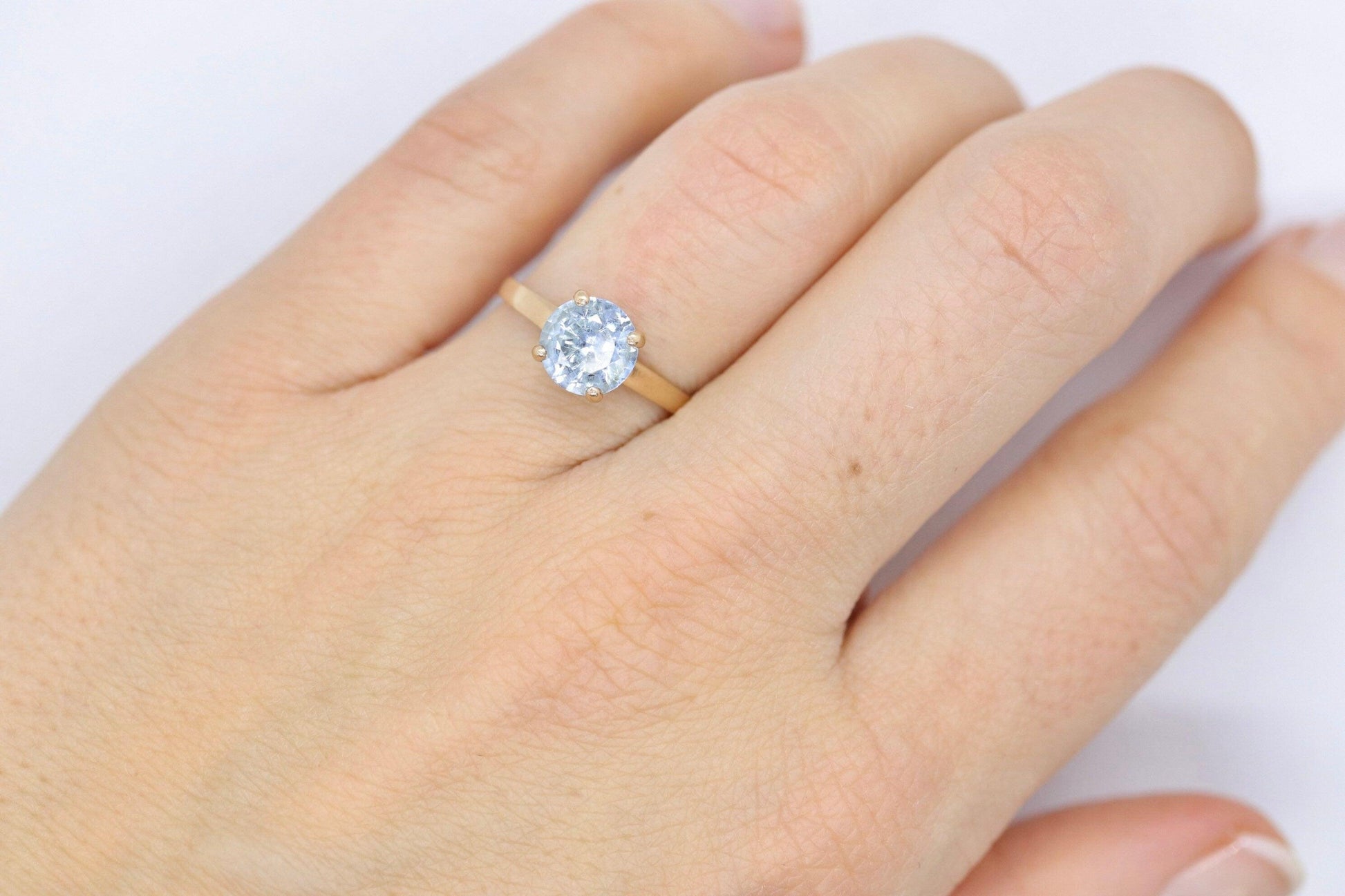 10k Aquamarine Topaz Solitaire Ring. 10k yellow gold band ring.