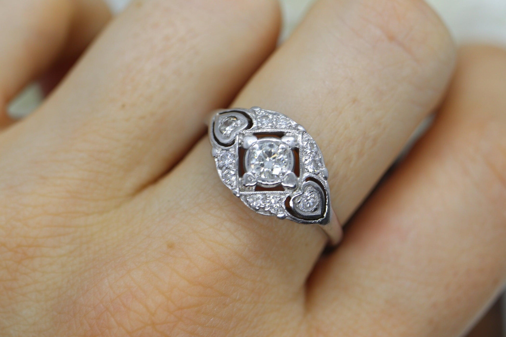 14k Art Deco Shield ring 14k white gold with diamonds and filigree open design.