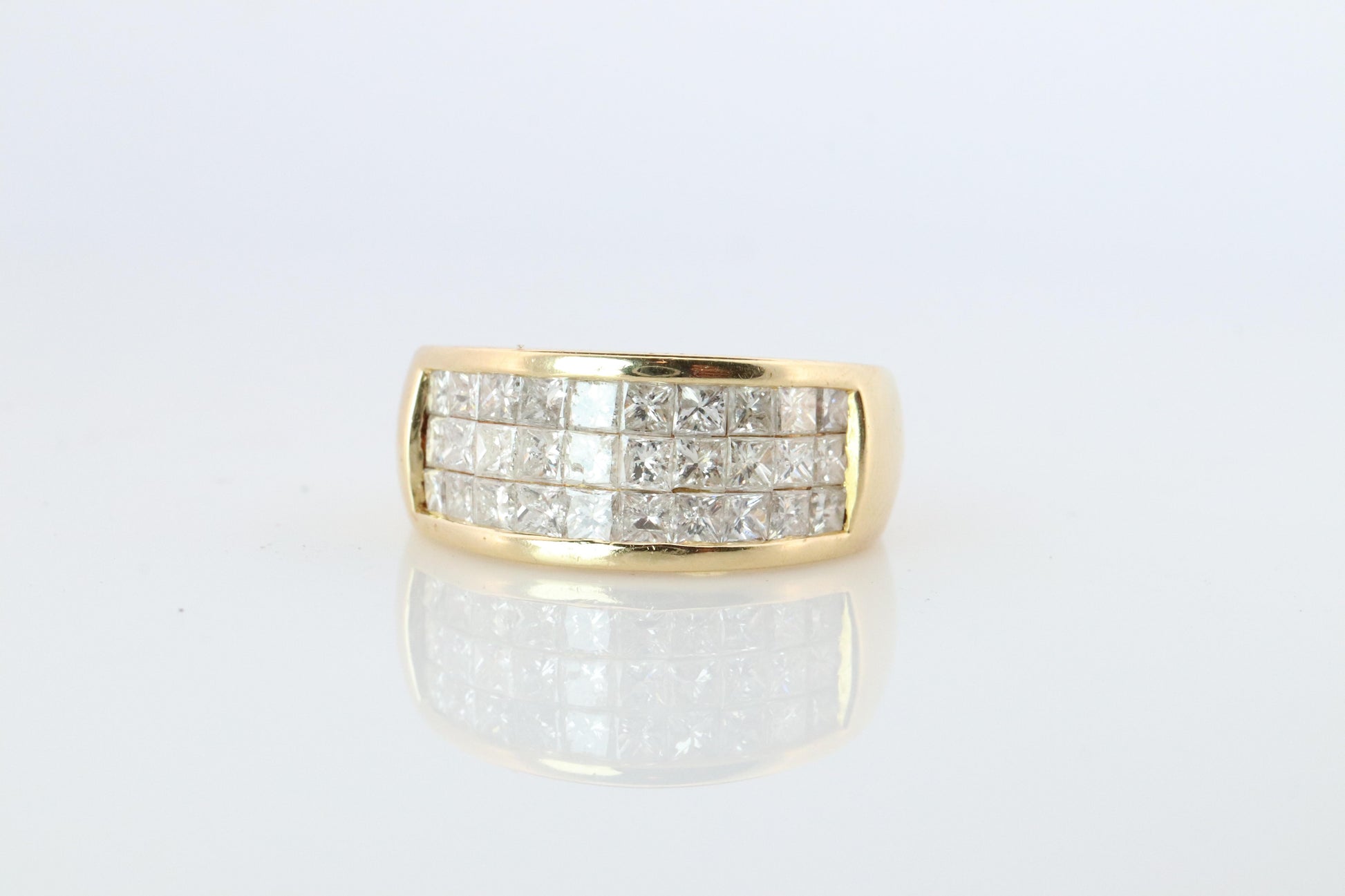 18k Diamond eternity band. 18k Yellow Gold Princess Cut Invisible Set ring.