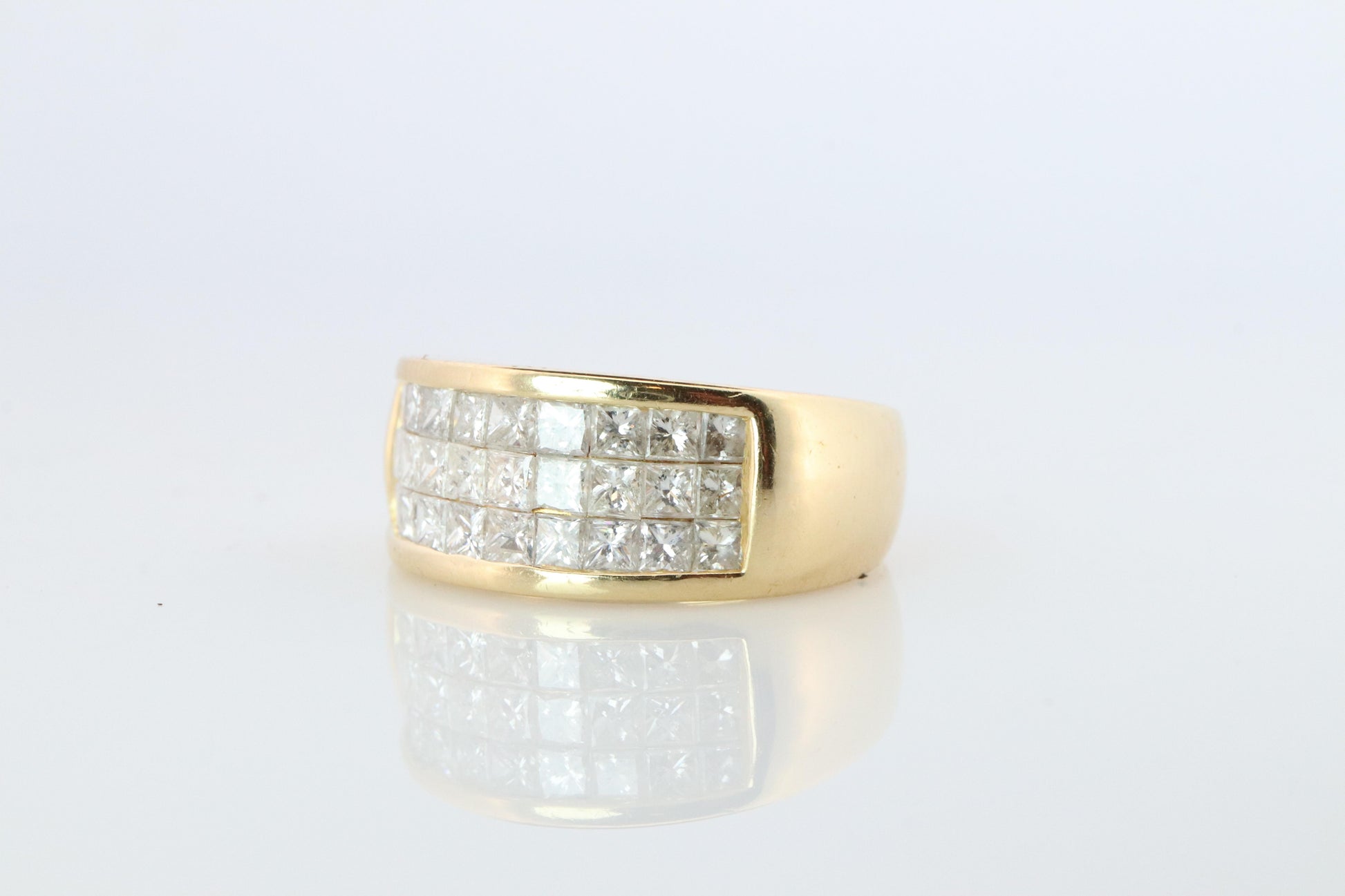 18k Diamond eternity band. 18k Yellow Gold Princess Cut Invisible Set ring.