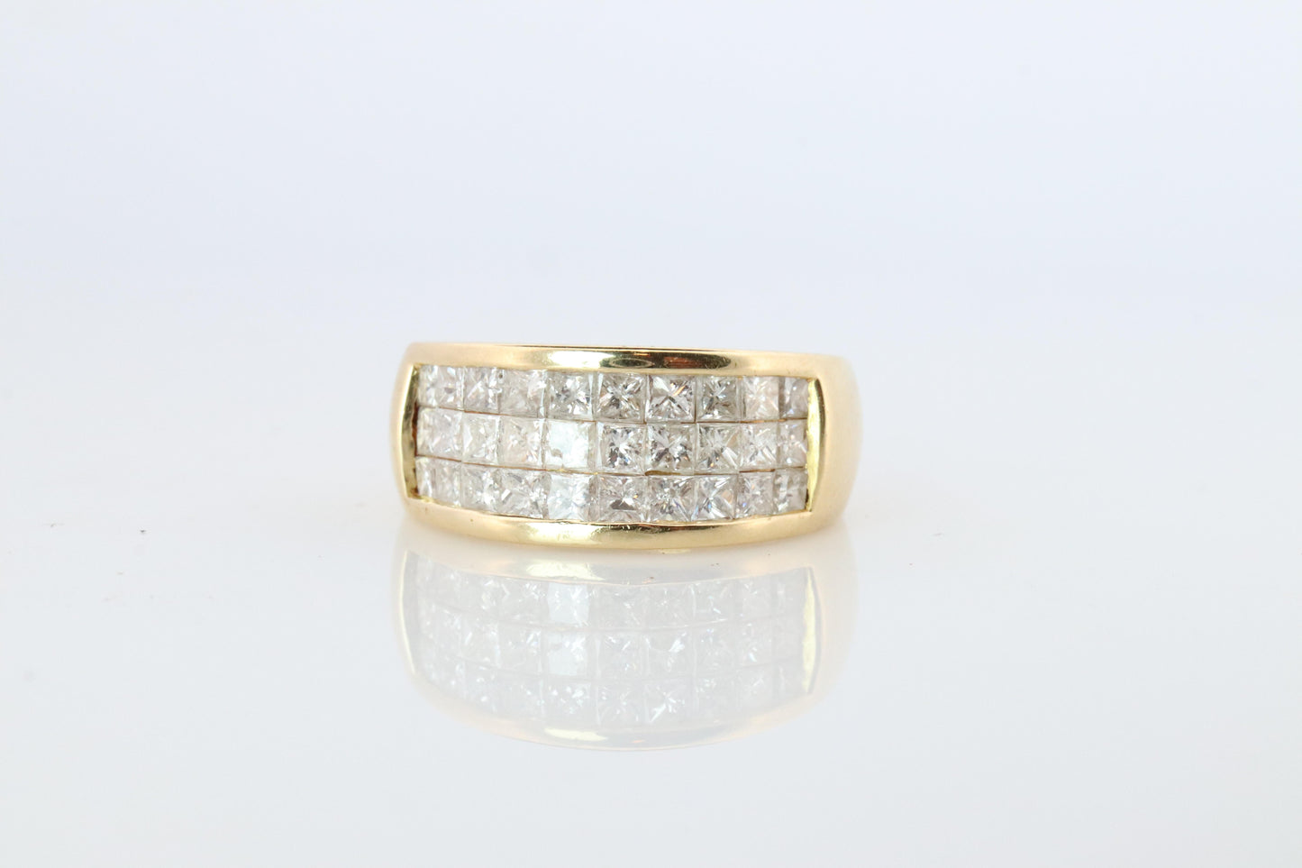 18k Diamond eternity band. 18k Yellow Gold Princess Cut Invisible Set ring.