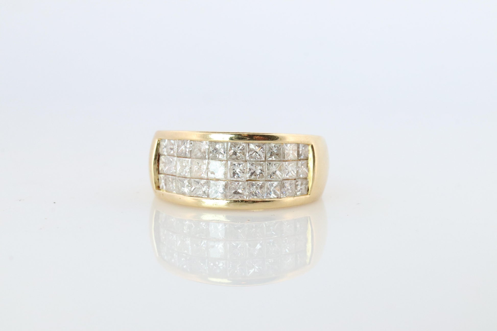 18k Diamond eternity band. 18k Yellow Gold Princess Cut Invisible Set ring.