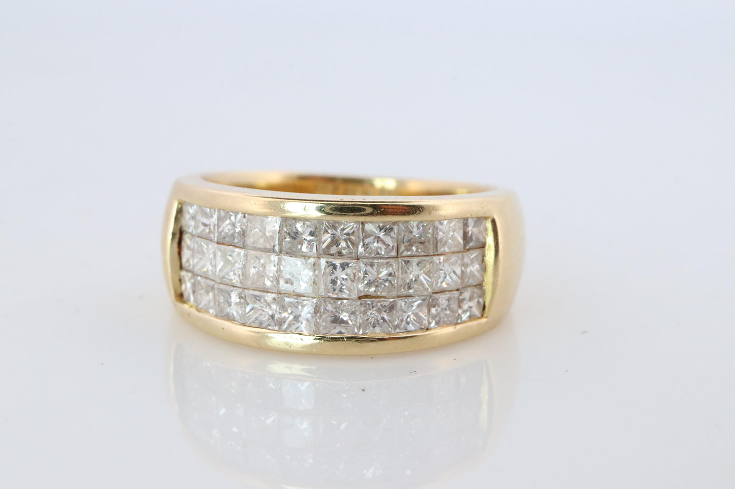 18k Diamond eternity band. 18k Yellow Gold Princess Cut Invisible Set ring.