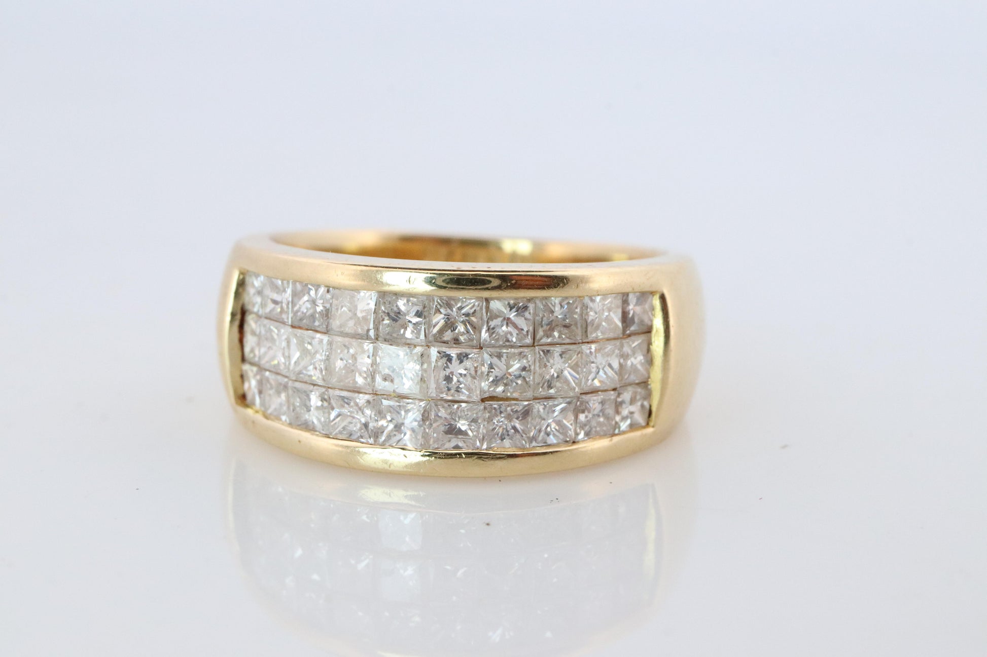 18k Diamond eternity band. 18k Yellow Gold Princess Cut Invisible Set ring.