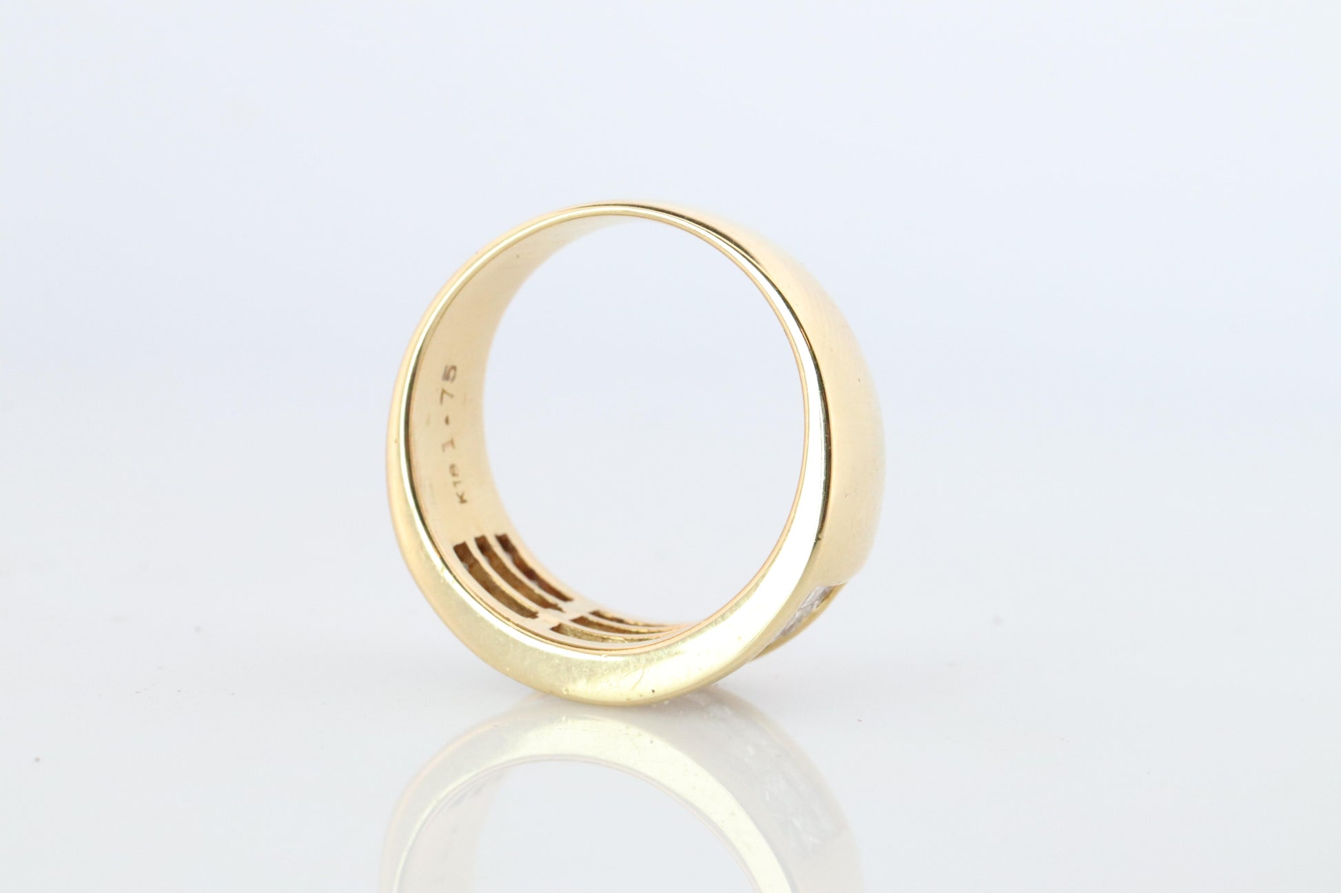 18k Diamond eternity band. 18k Yellow Gold Princess Cut Invisible Set ring.
