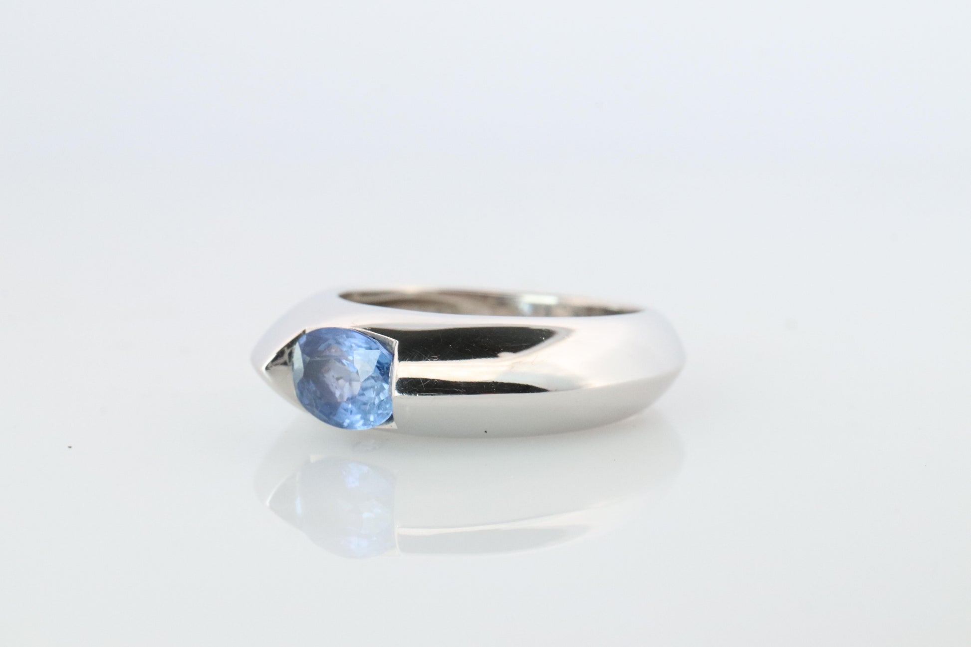 Genuine Piaget Oval Sapphire and Diamond Solitaire Ring. 18k White Gold Band