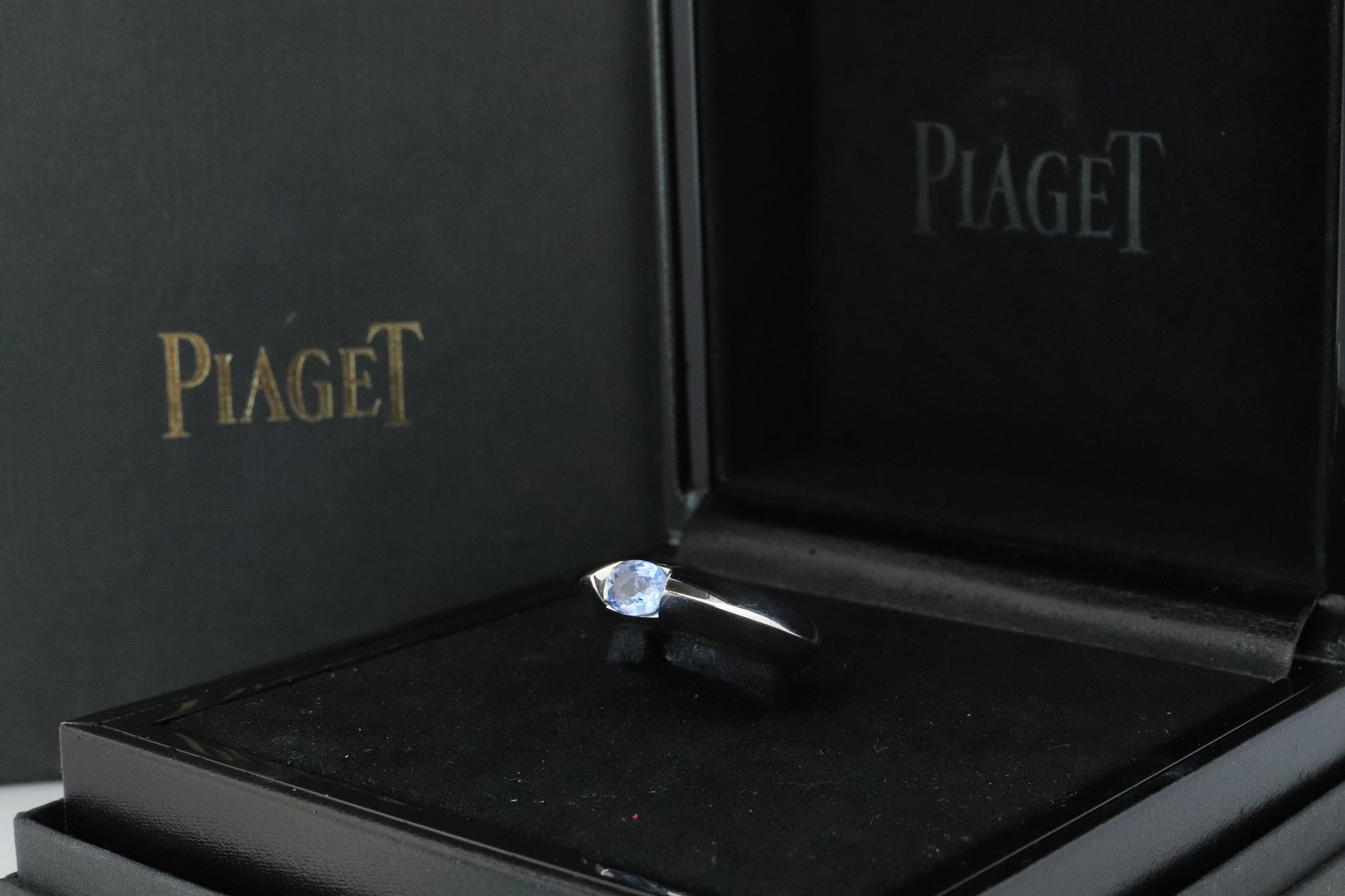Genuine Piaget Oval Sapphire and Diamond Solitaire Ring. 18k White Gold Band