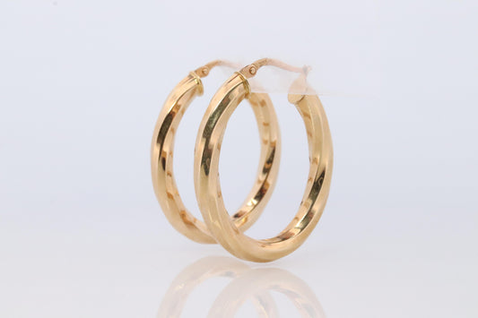 14k Gold Puffed Hollow HOOP Earrings. Large Oval HOOP earrings Twisted design.