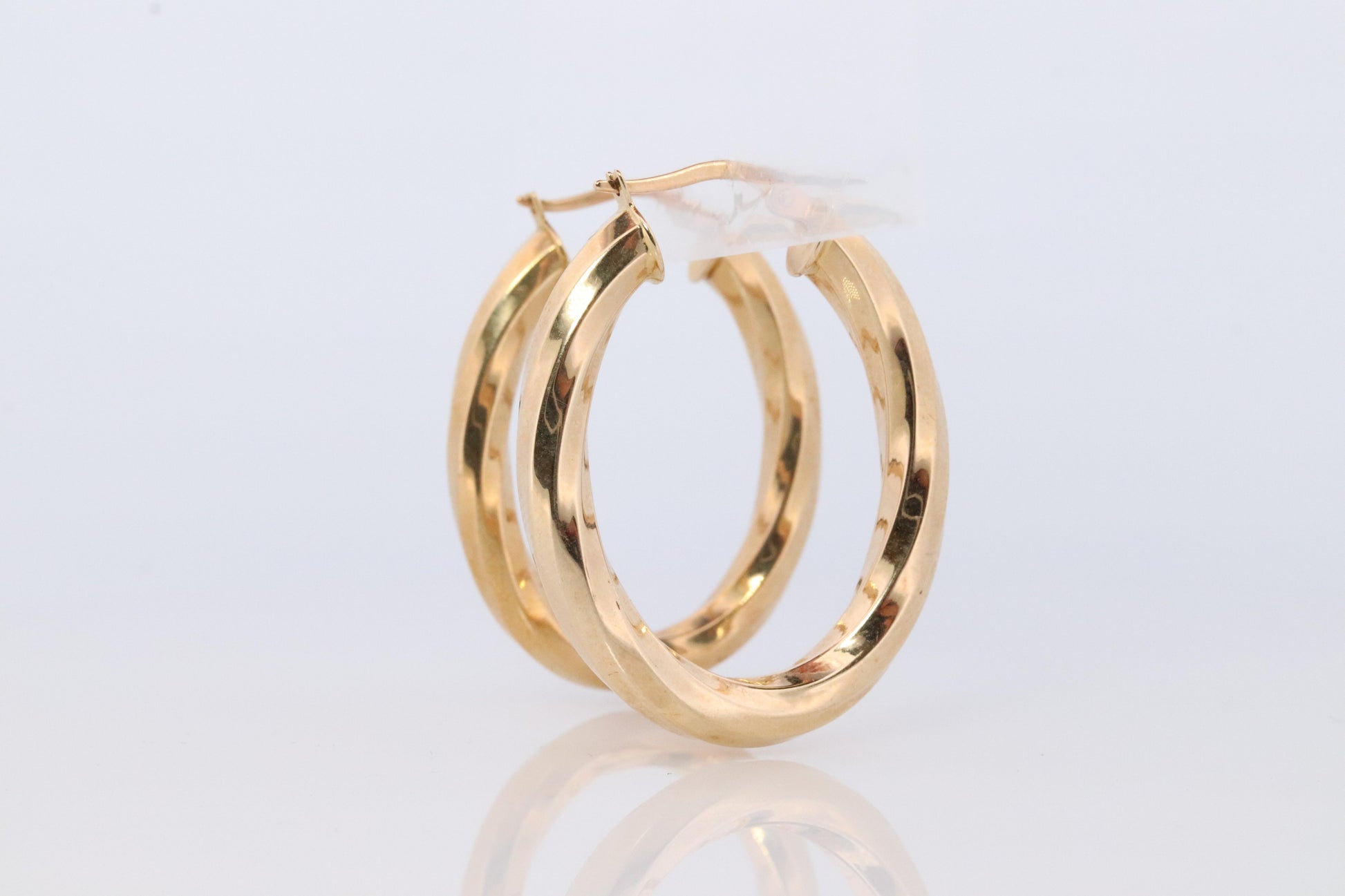 14k Gold Puffed Hollow HOOP Earrings. Large Oval HOOP earrings Twisted design.