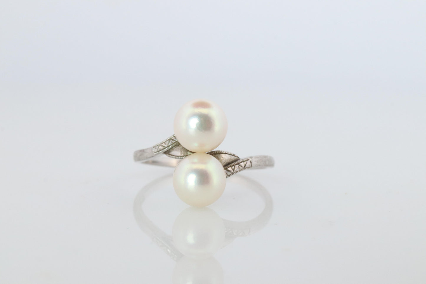Mikimoto Pearl Ring. Sterling Silver Mikimoto Sapphire Twin Pearl Bypass band.