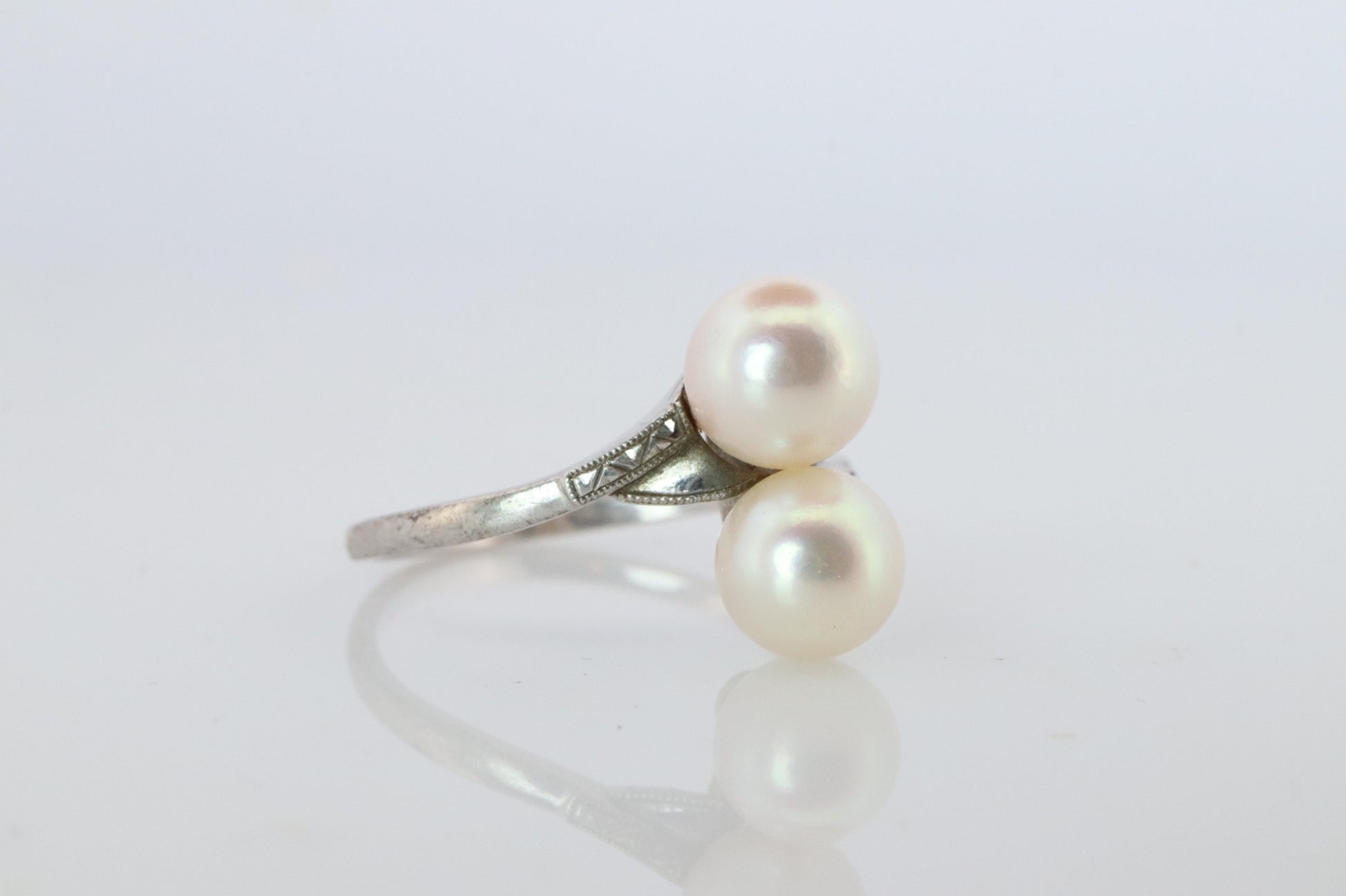 Mikimoto Pearl Ring. Sterling Silver Mikimoto Sapphire Twin Pearl Bypass band.