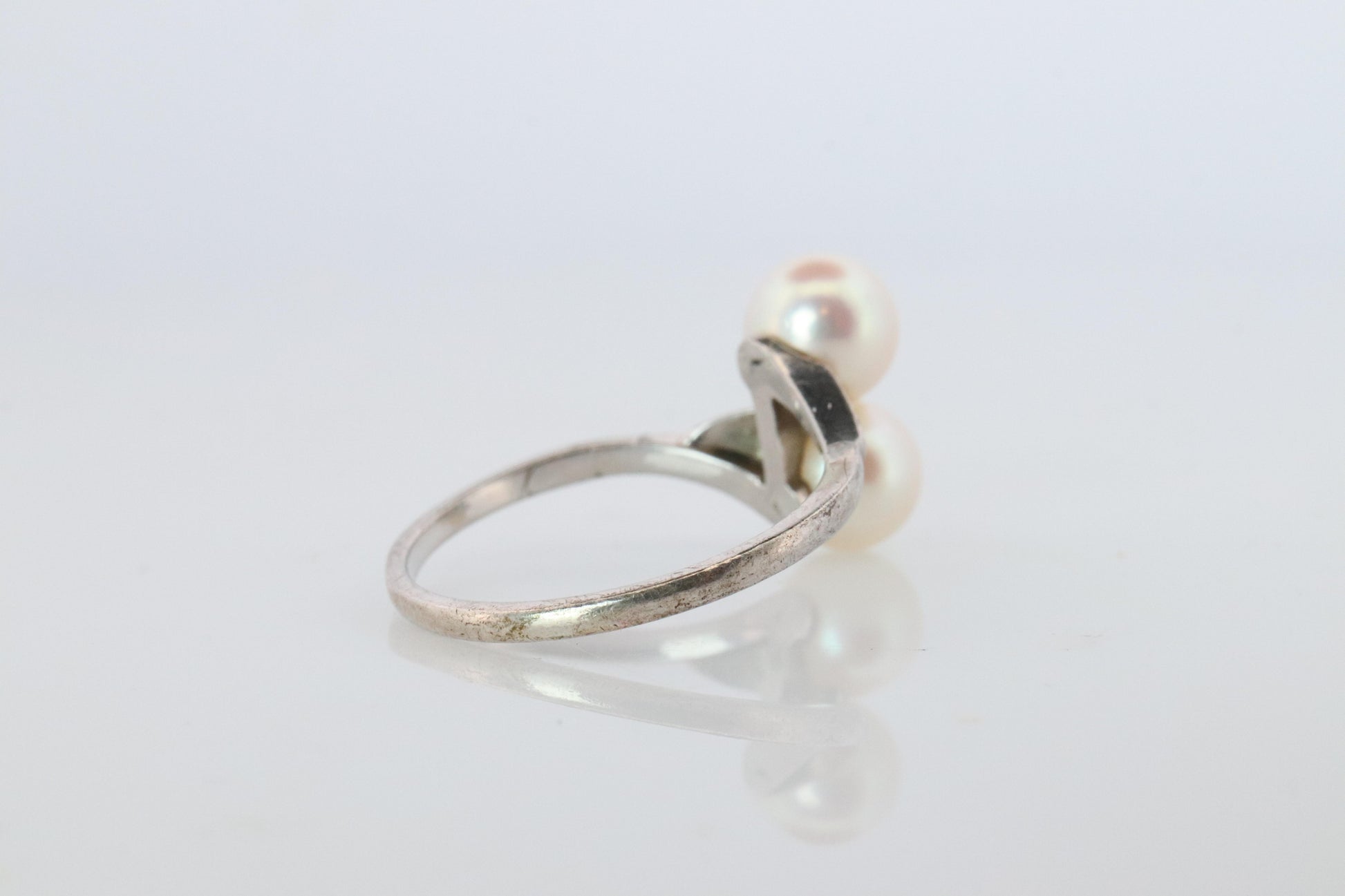 Mikimoto Pearl Ring. Sterling Silver Mikimoto Sapphire Twin Pearl Bypass band.
