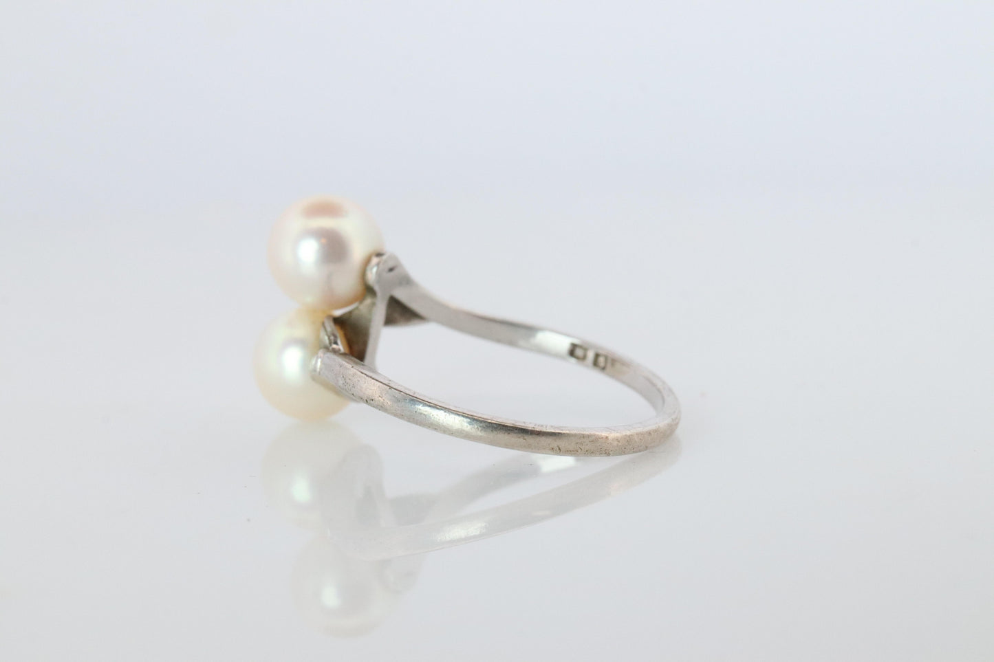 Mikimoto Pearl Ring. Sterling Silver Mikimoto Sapphire Twin Pearl Bypass band.