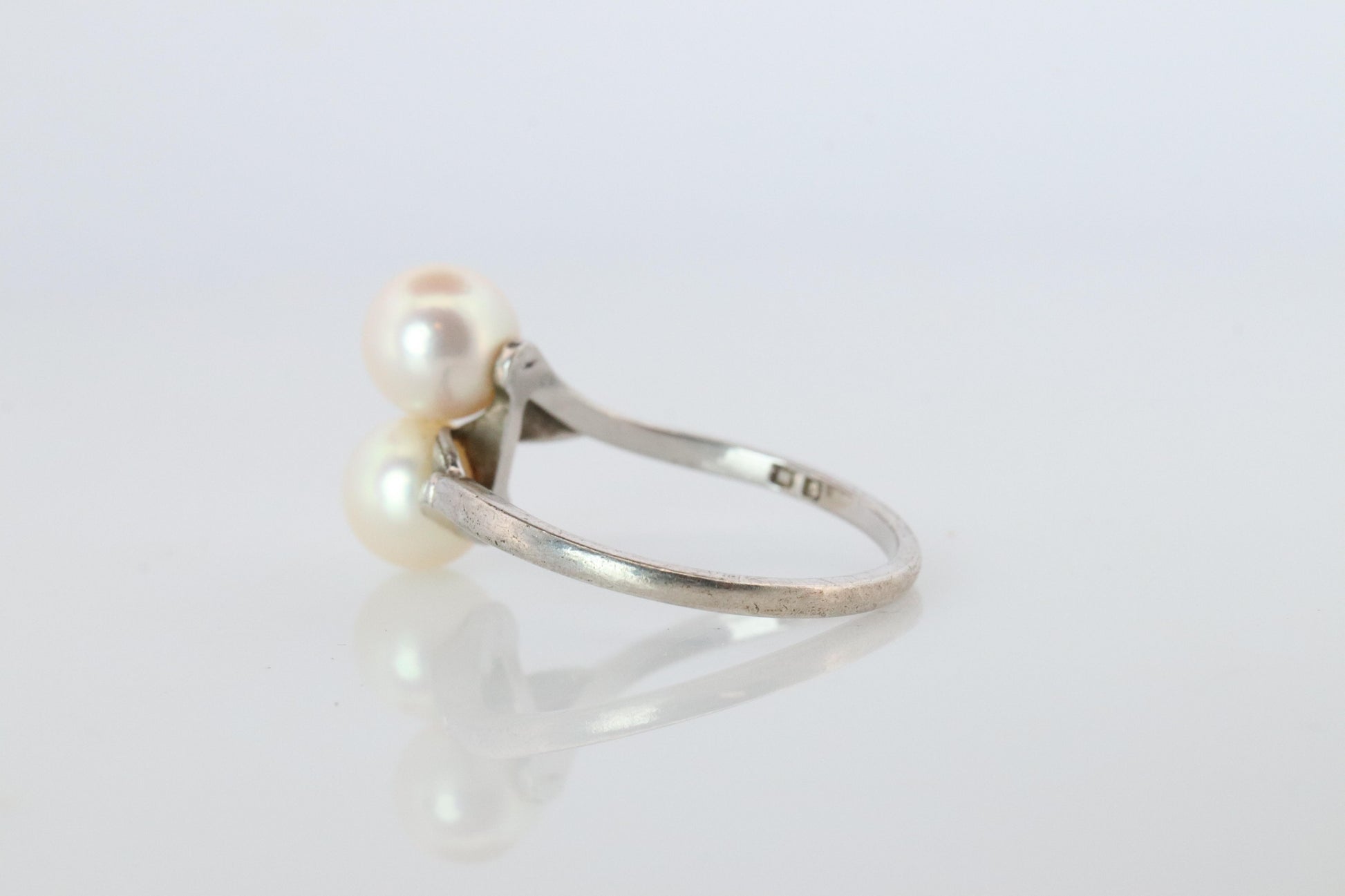 Mikimoto Pearl Ring. Sterling Silver Mikimoto Sapphire Twin Pearl Bypass band.