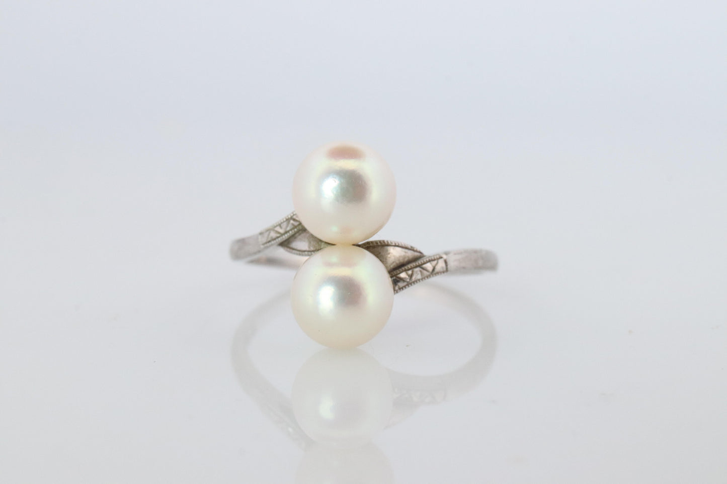 Mikimoto Pearl Ring. Sterling Silver Mikimoto Sapphire Twin Pearl Bypass band.