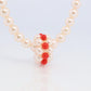 Tasaki Necklace. 18k Tasaki Pearl and Coral Bead Strand Necklace.