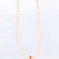 Tasaki Necklace. 18k Tasaki Pearl and Coral Bead Strand Necklace.