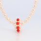 Tasaki Necklace. 18k Tasaki Pearl and Coral Bead Strand Necklace.