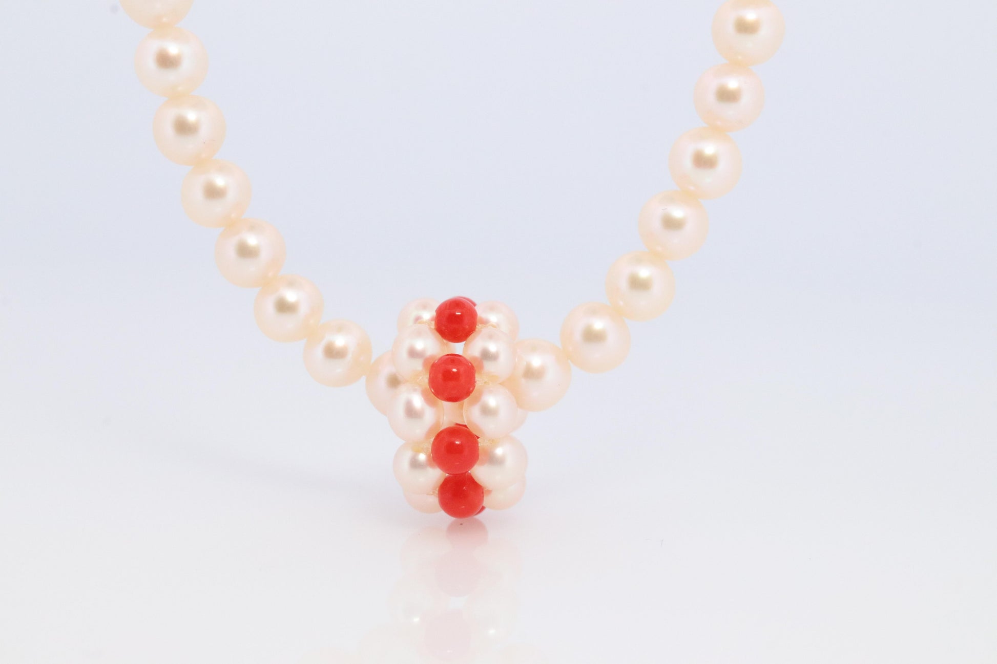 Tasaki Necklace. 18k Tasaki Pearl and Coral Bead Strand Necklace.