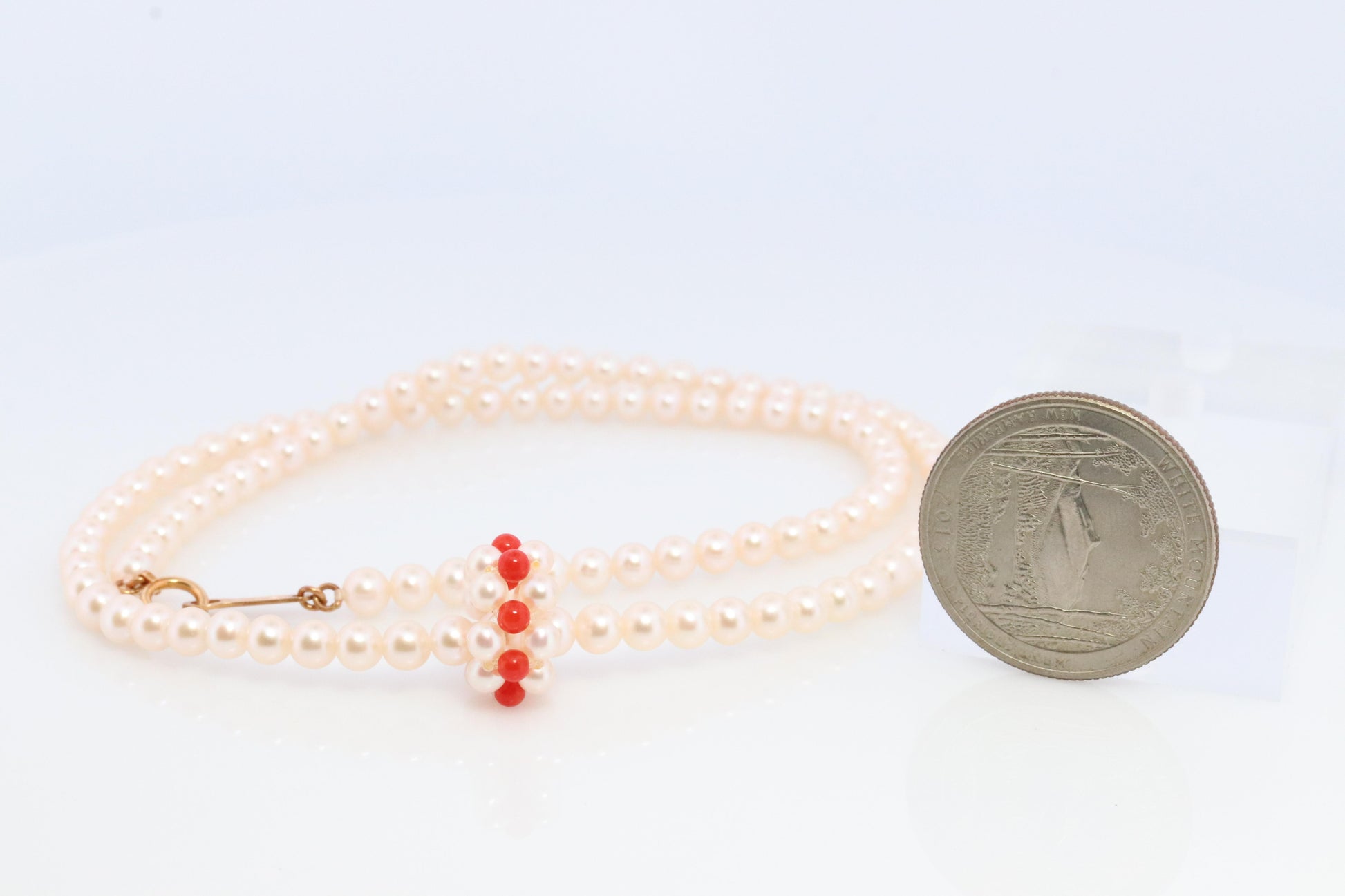 Tasaki Necklace. 18k Tasaki Pearl and Coral Bead Strand Necklace.