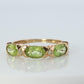 10k Green Peridot and diamond band. 10k yellow gold 3 stone peridot ring.