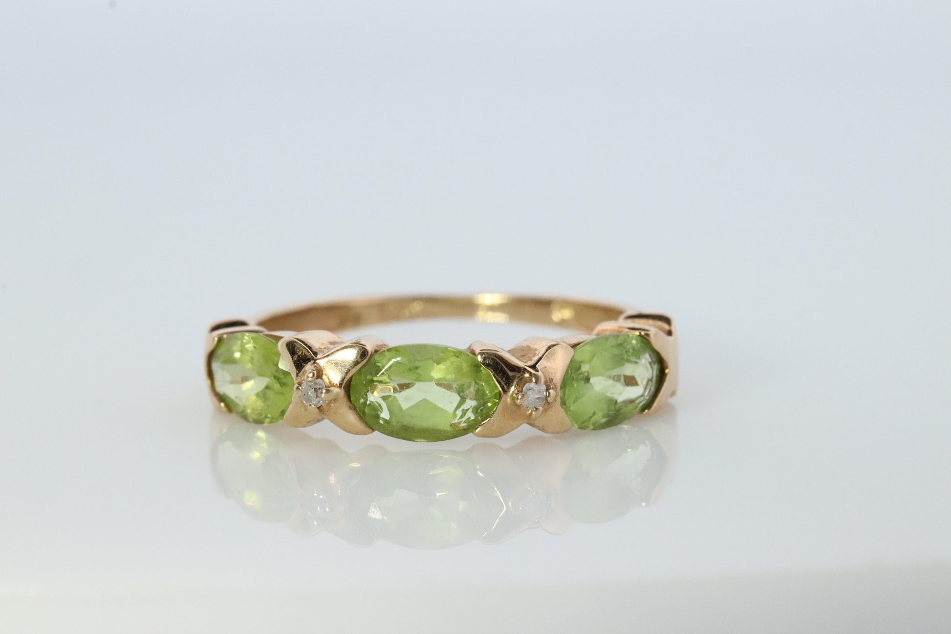 10k Green Peridot and diamond band. 10k yellow gold 3 stone peridot ring.