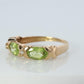 10k Green Peridot and diamond band. 10k yellow gold 3 stone peridot ring.