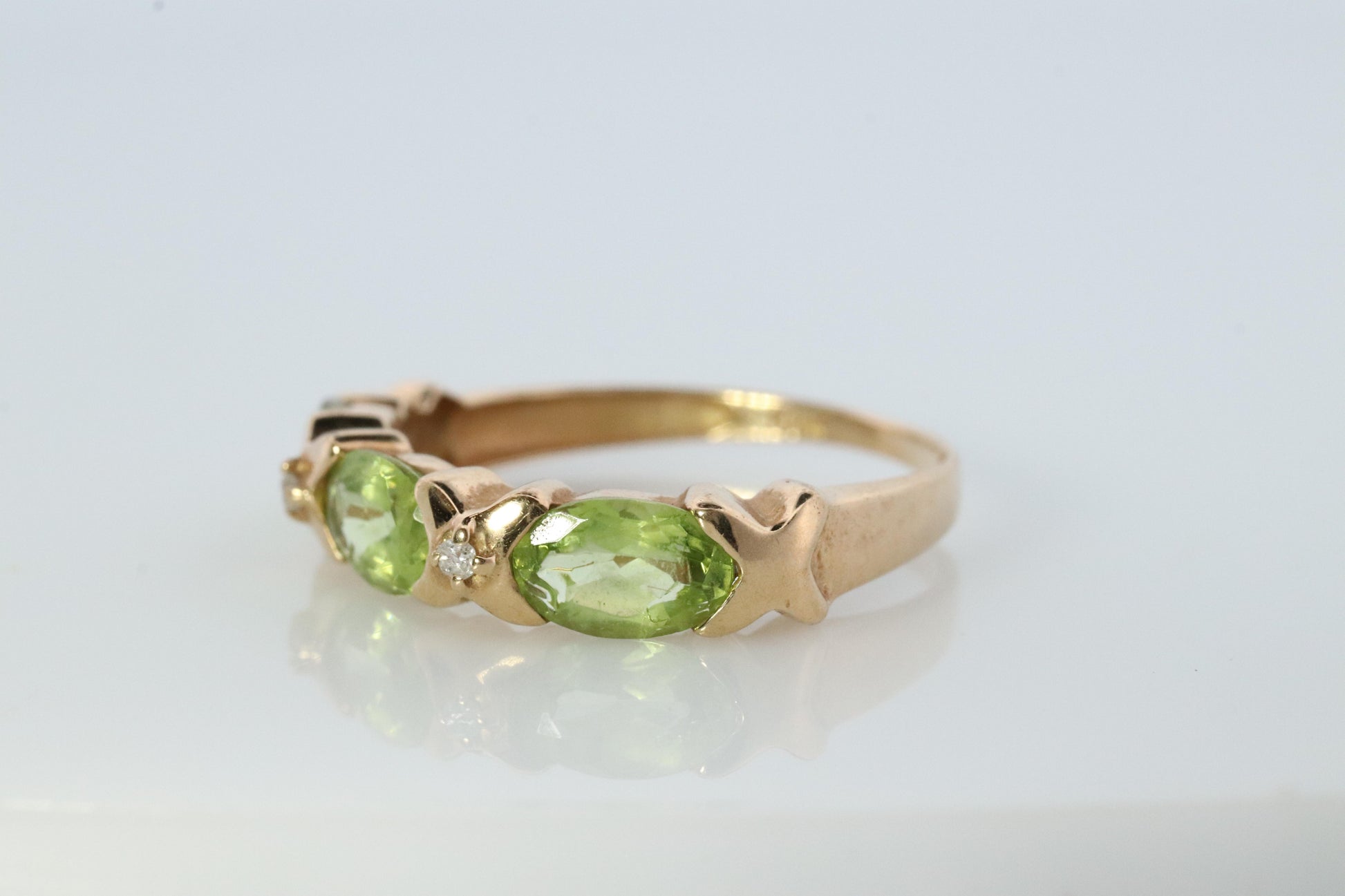 10k Green Peridot and diamond band. 10k yellow gold 3 stone peridot ring.