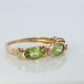 10k Green Peridot and diamond band. 10k yellow gold 3 stone peridot ring.