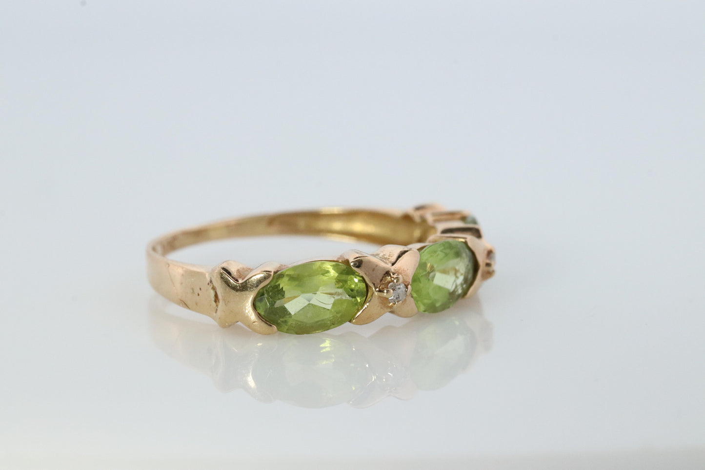 10k Green Peridot and diamond band. 10k yellow gold 3 stone peridot ring.