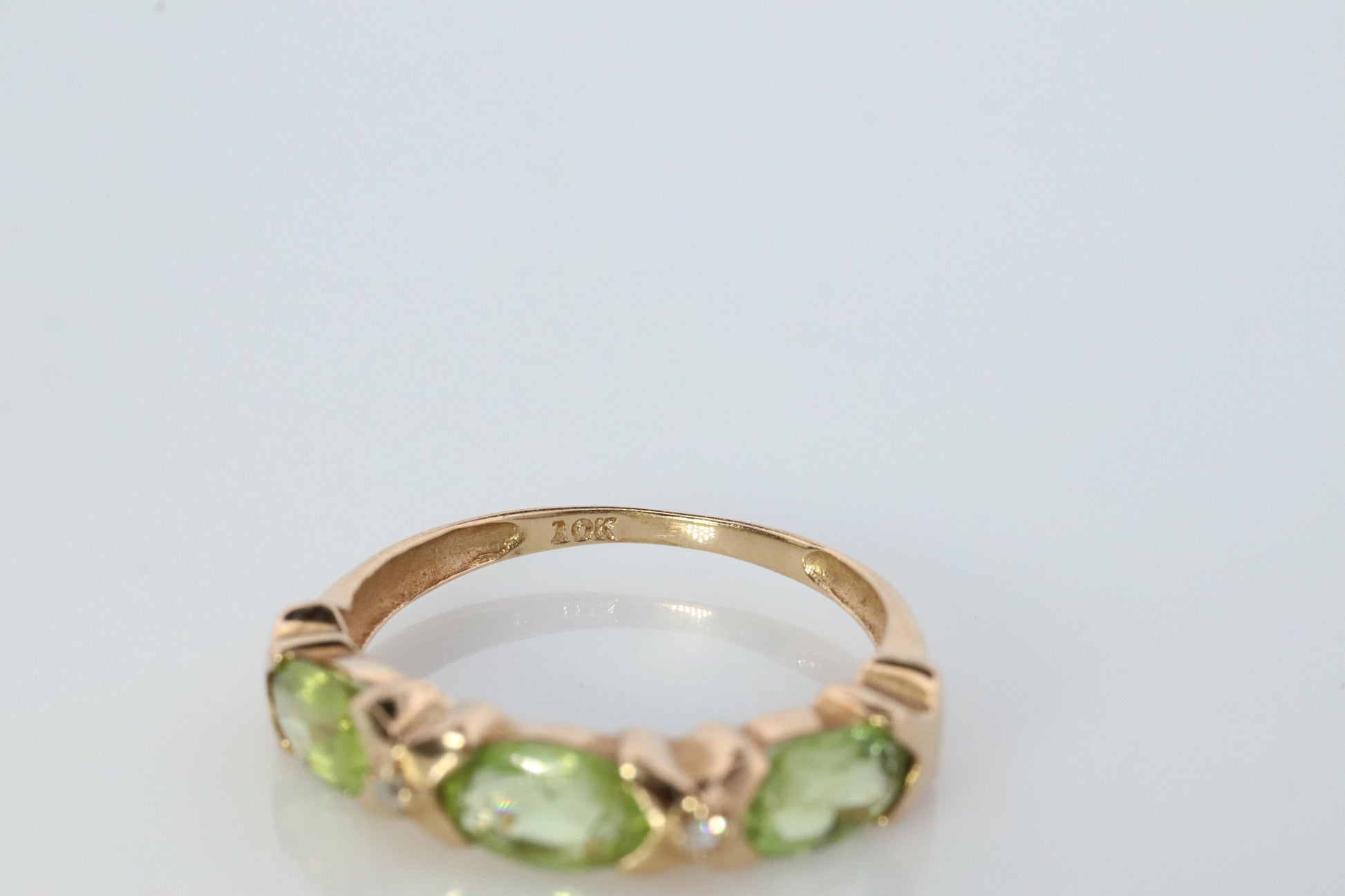 10k Green Peridot and diamond band. 10k yellow gold 3 stone peridot ring.