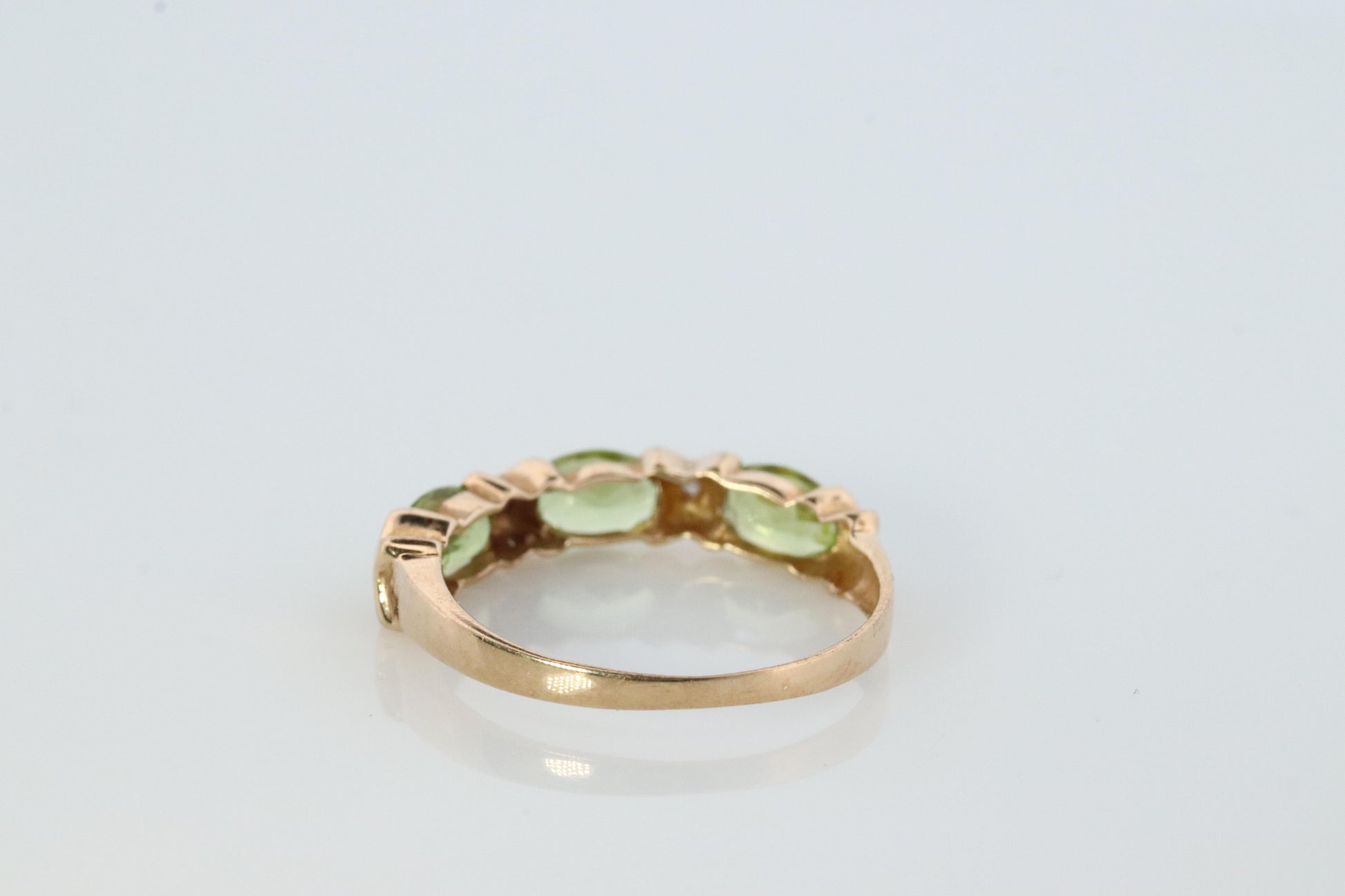 10k Green Peridot and diamond band. 10k yellow gold 3 stone peridot ring.