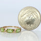 10k Green Peridot and diamond band. 10k yellow gold 3 stone peridot ring.