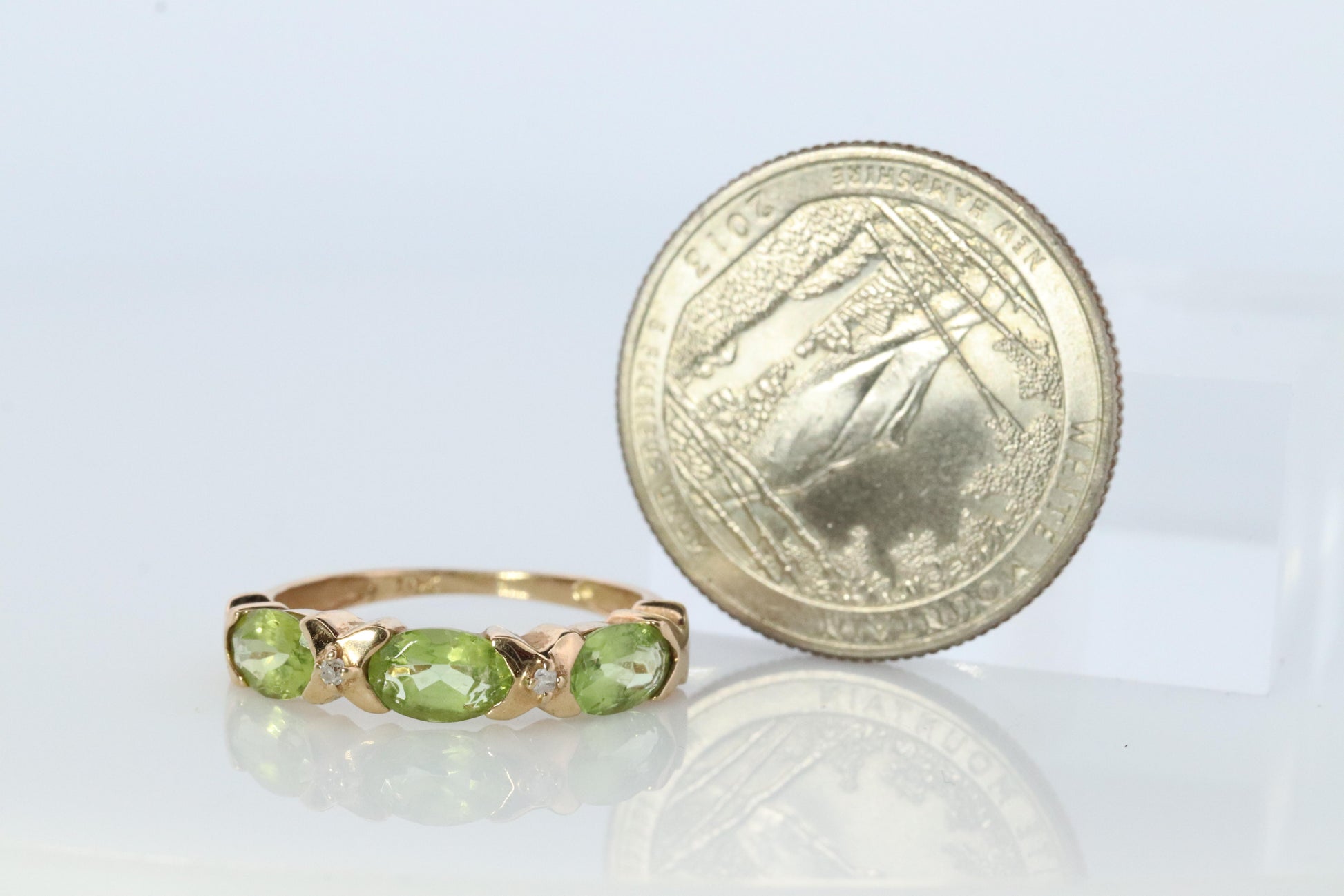 10k Green Peridot and diamond band. 10k yellow gold 3 stone peridot ring.