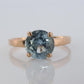 10k Aquamarine Topaz Solitaire Ring. 10k yellow gold band ring.