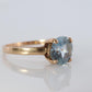 10k Aquamarine Topaz Solitaire Ring. 10k yellow gold band ring.