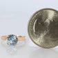 10k Aquamarine Topaz Solitaire Ring. 10k yellow gold band ring.