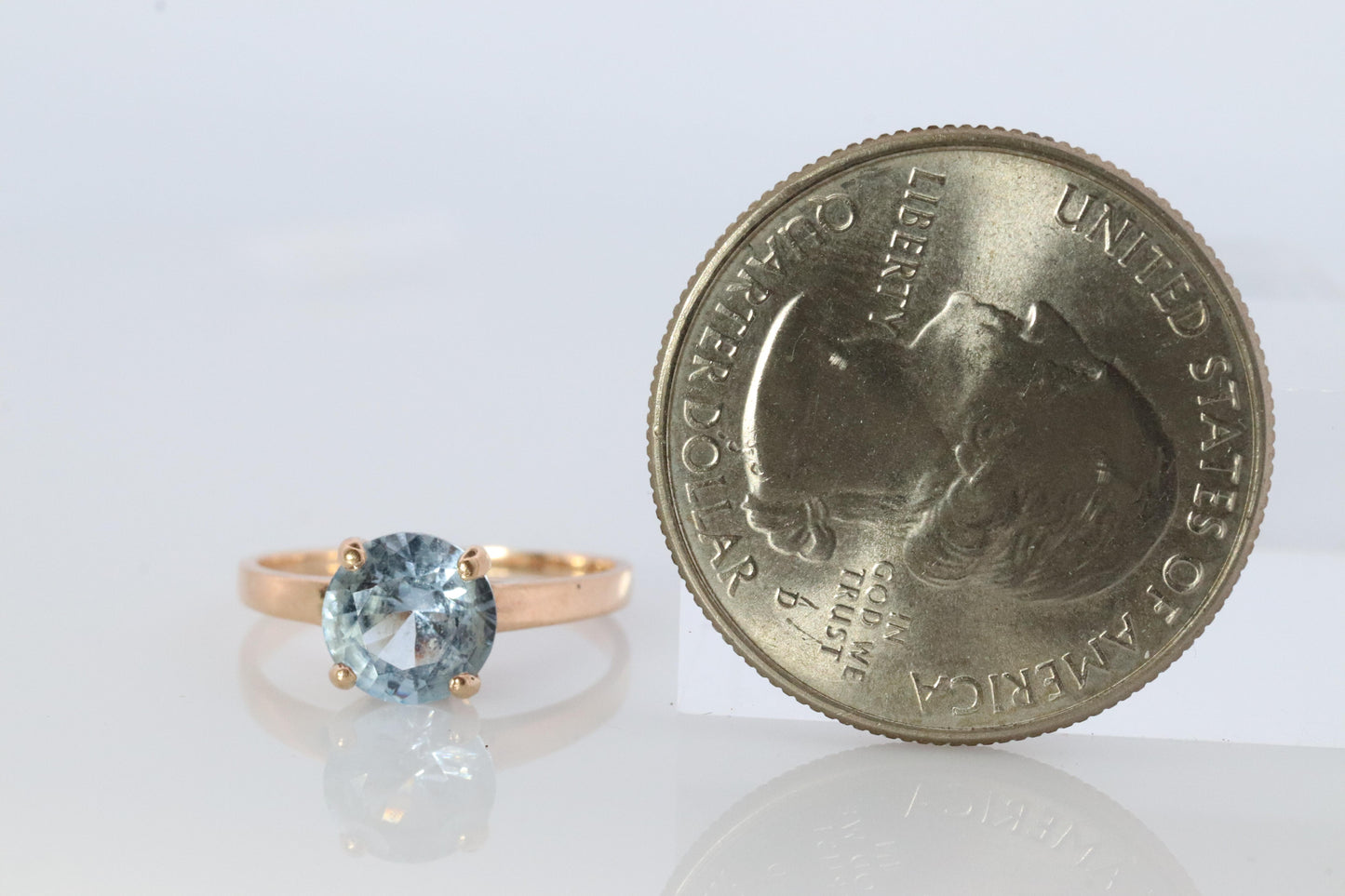 10k Aquamarine Topaz Solitaire Ring. 10k yellow gold band ring.