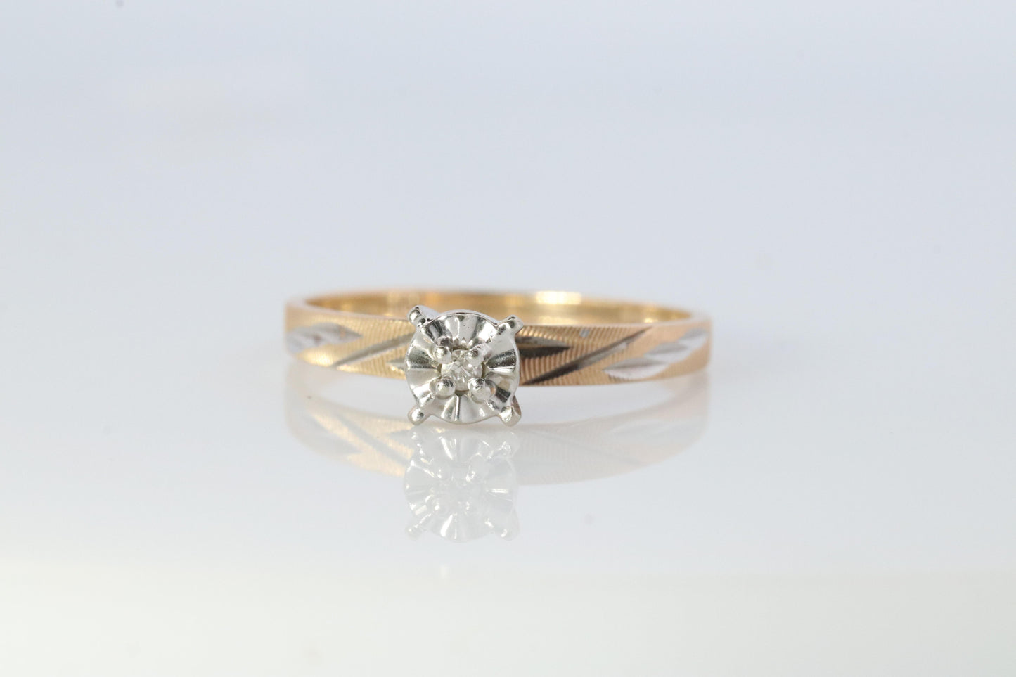 10k Diamond Solitaire. 10k Yellow gold engraved illusion set diamond ring.