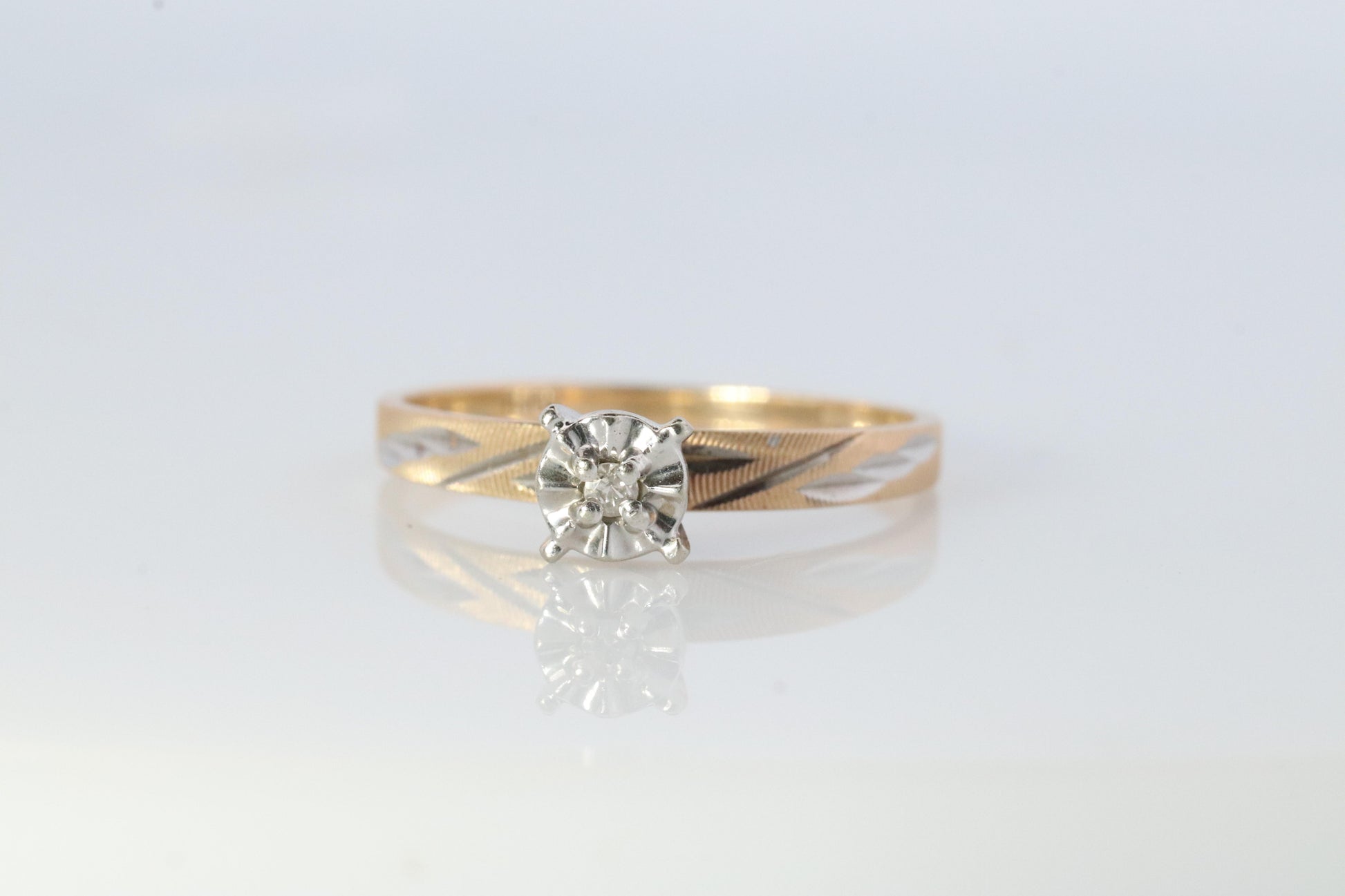 10k Diamond Solitaire. 10k Yellow gold engraved illusion set diamond ring.