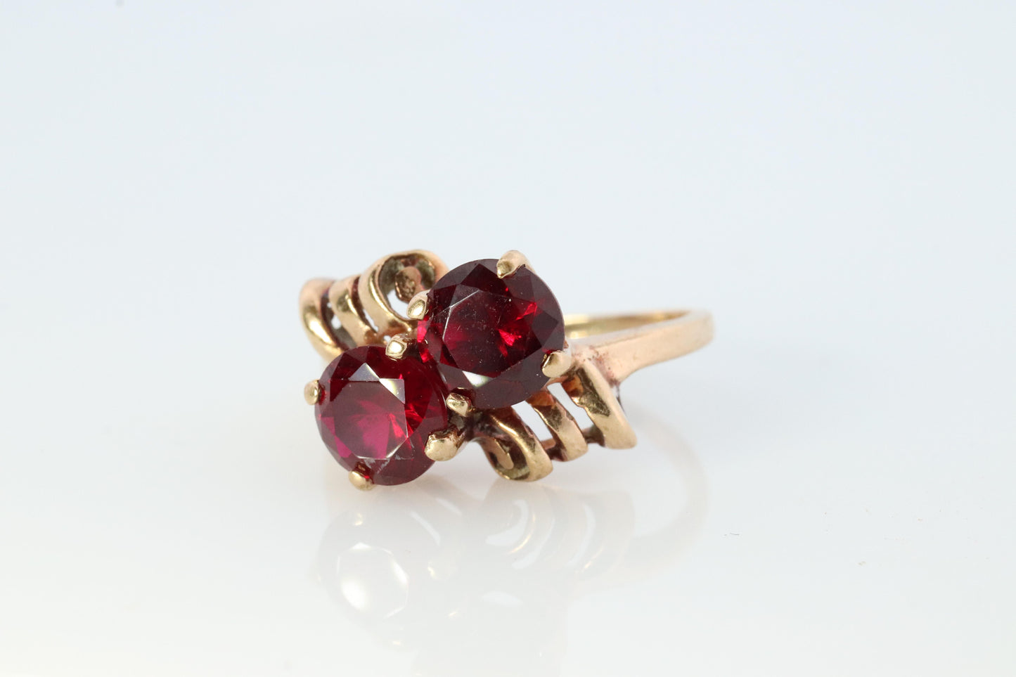 10k Victorian Claw Set Ruby Ring. Twin gem bypass bow ring.