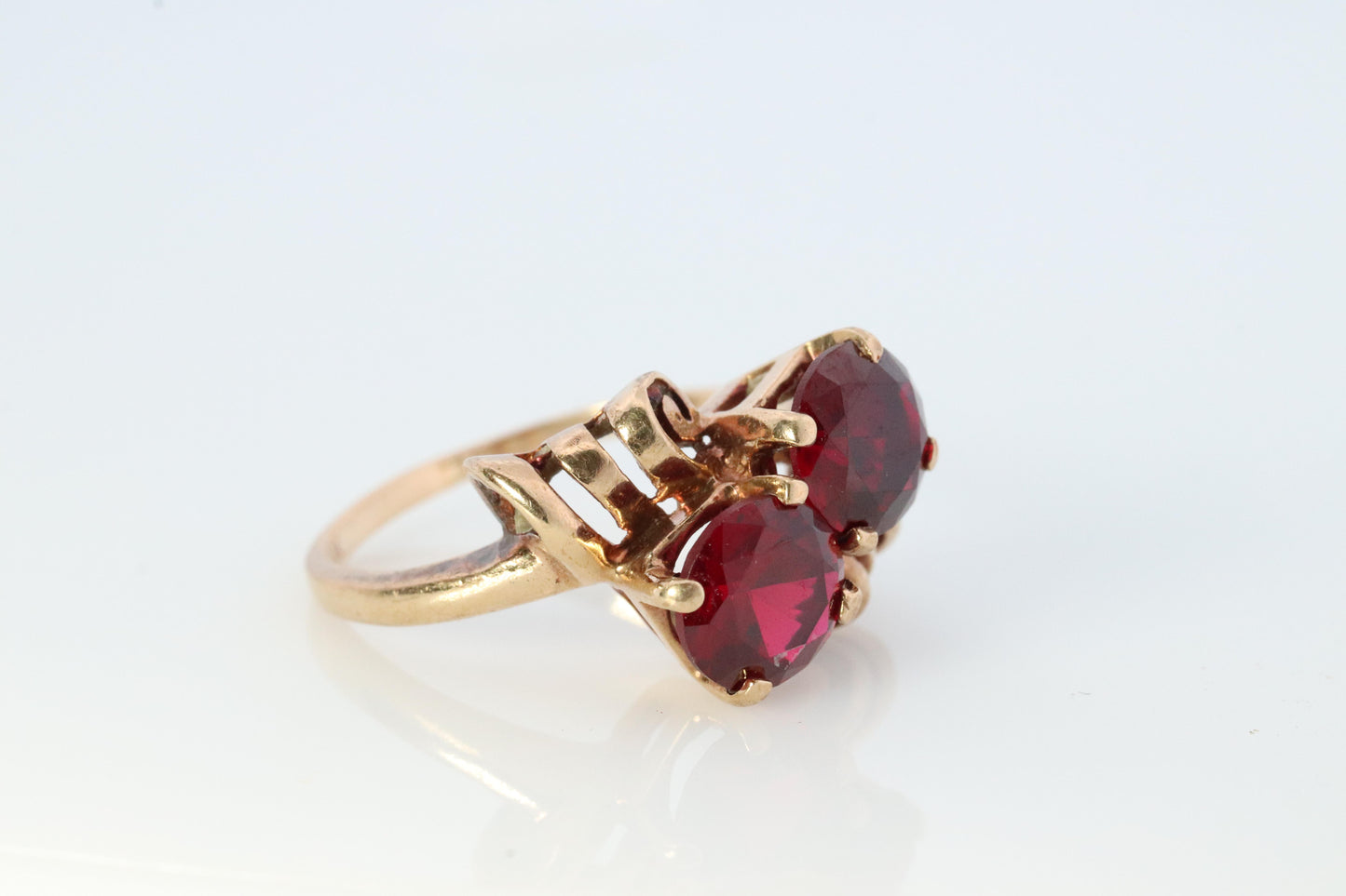 10k Victorian Claw Set Ruby Ring. Twin gem bypass bow ring.