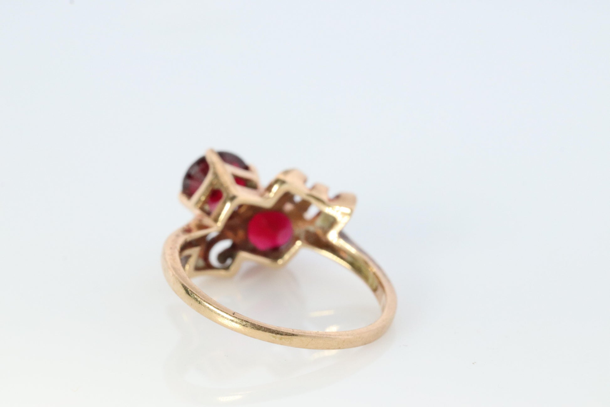 10k Victorian Claw Set Ruby Ring. Twin gem bypass bow ring.