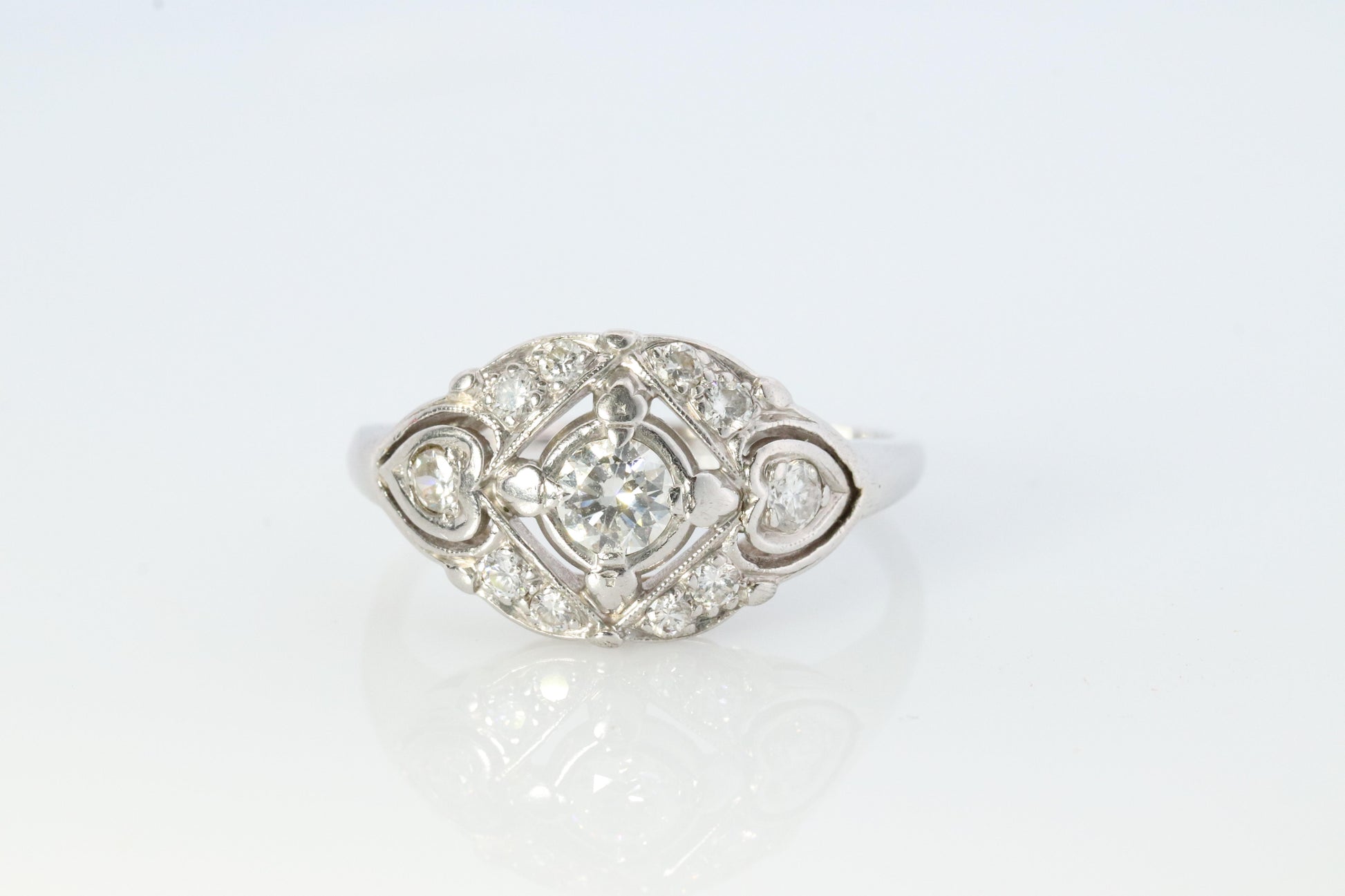 14k Art Deco Shield ring 14k white gold with diamonds and filigree open design.