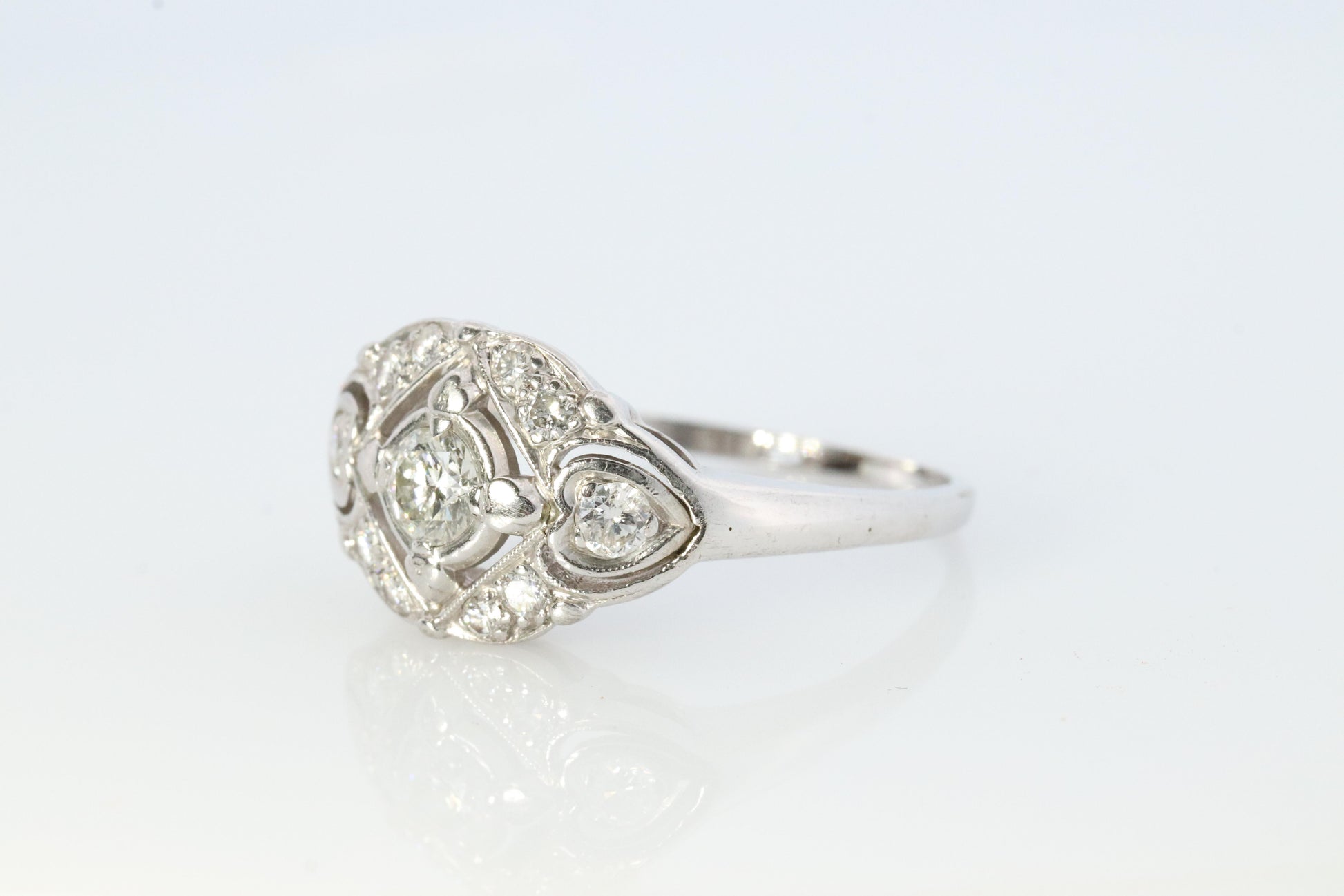 14k Art Deco Shield ring 14k white gold with diamonds and filigree open design.