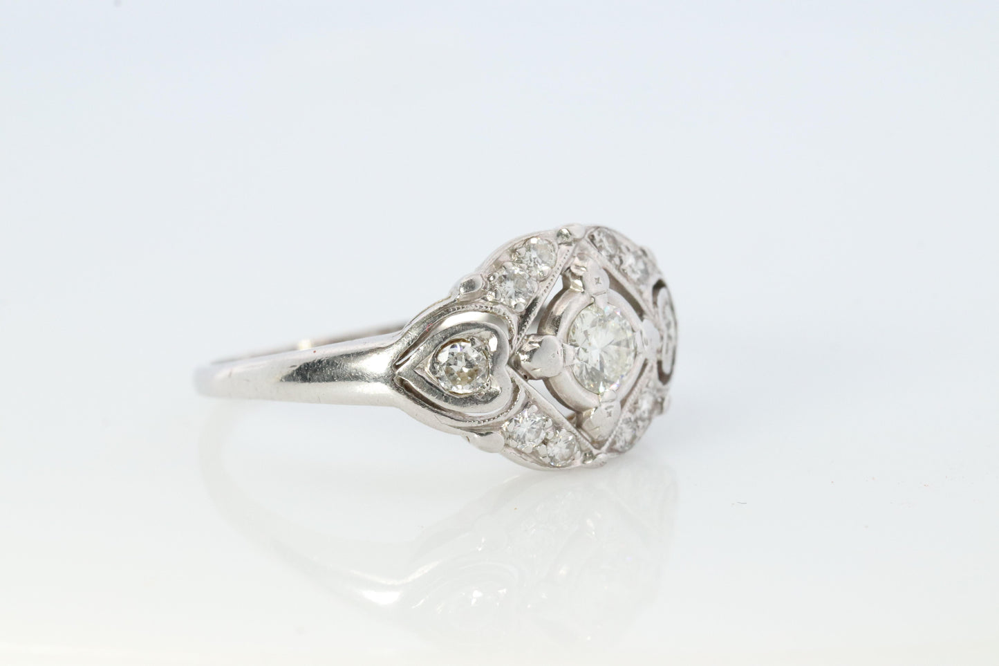 14k Art Deco Shield ring 14k white gold with diamonds and filigree open design.