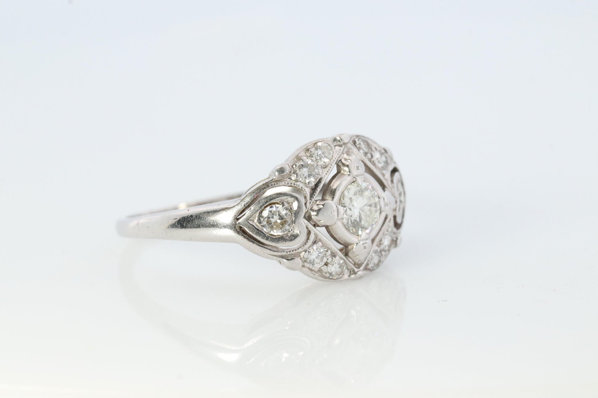 14k Art Deco Shield ring 14k white gold with diamonds and filigree open design.